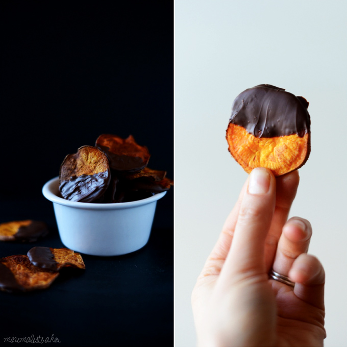 Holding up a Dark Chocolate Sweet Potato Chip alongside a bowl of more of them