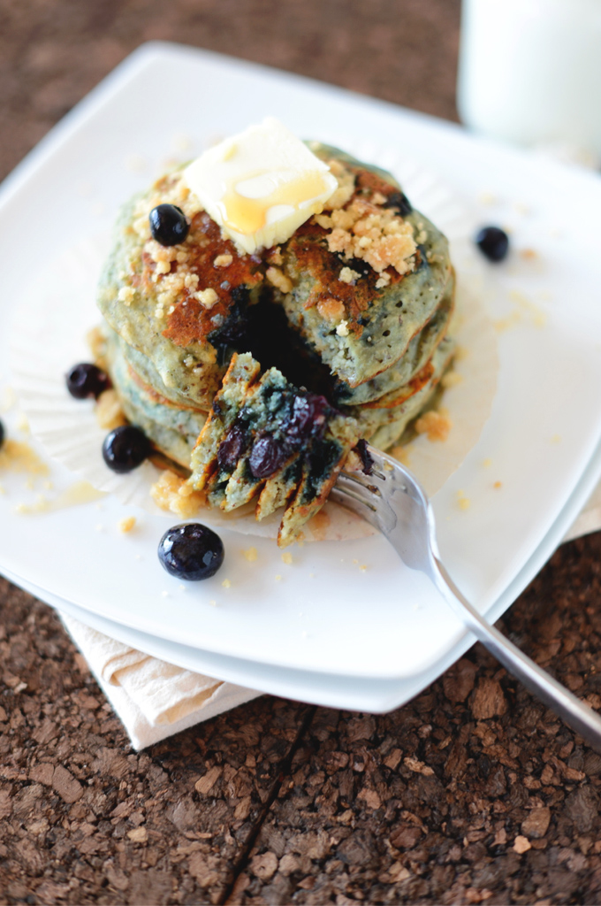Bite of Vegan Blueberry Muffin Pancakes speared with a fork