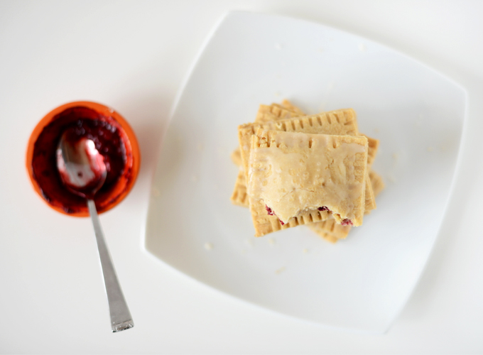 Plate of Healthy Pop Tarts and a bowl of mixed berry compote used to fill them