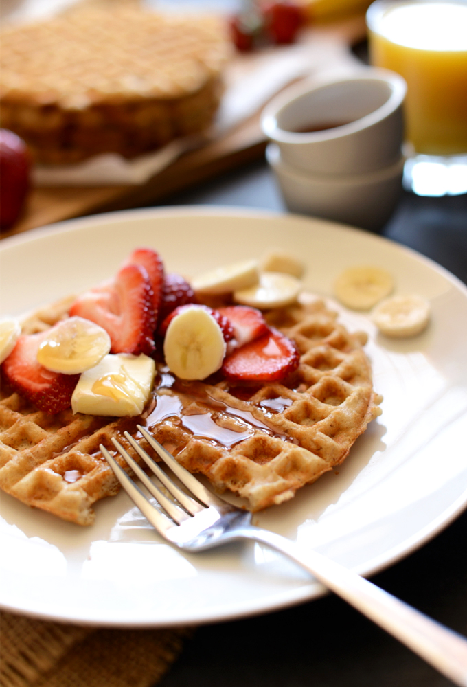 The Best Gluten-Free Waffle topped with fresh fruit and syrup
