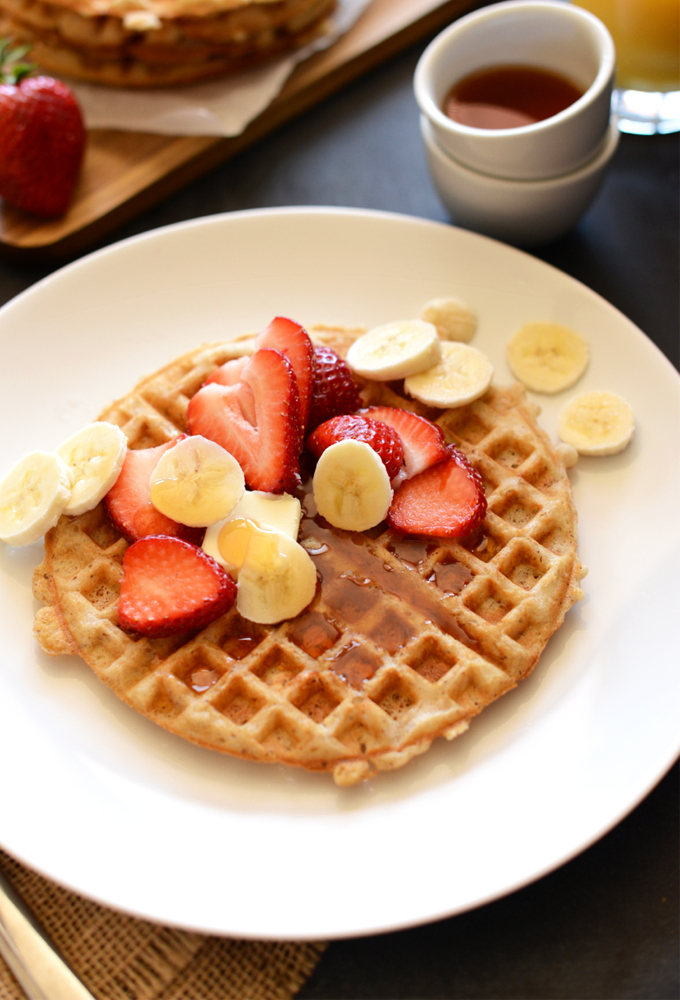 Plate with an Oatmeal Waffle topped with fresh fruit for a delicious gluten-free vegan breakfast