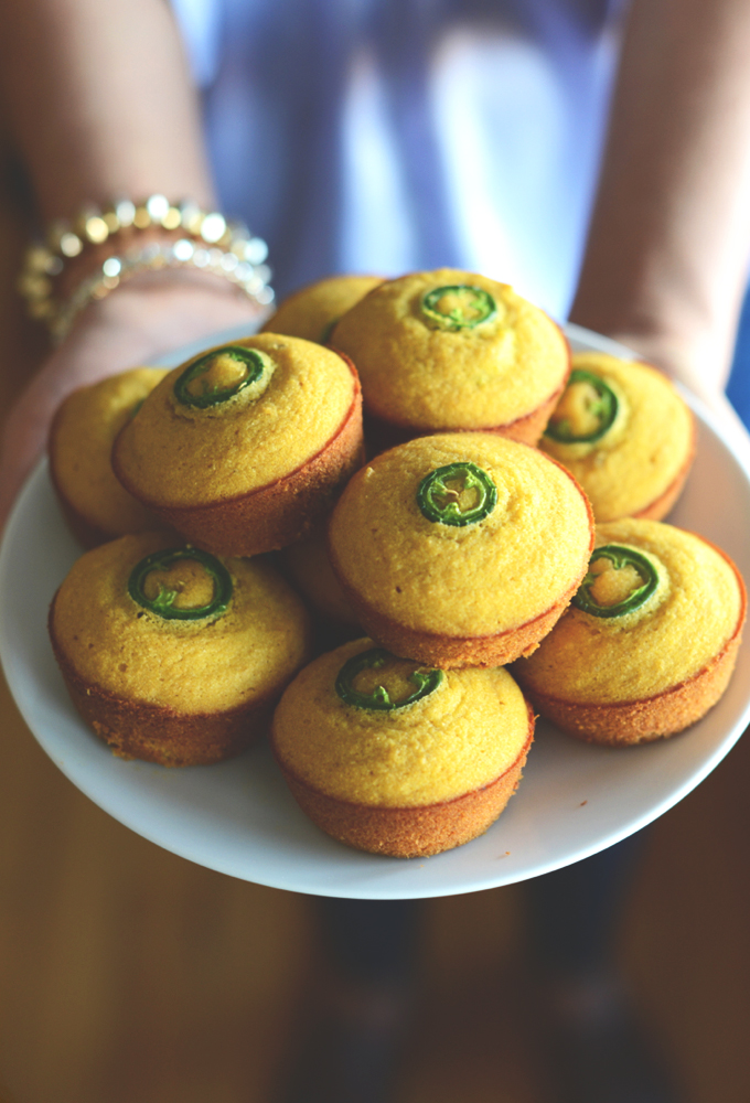 Holding a plate of our Gluten-Free Jalapeno Cornbread Muffins recipe