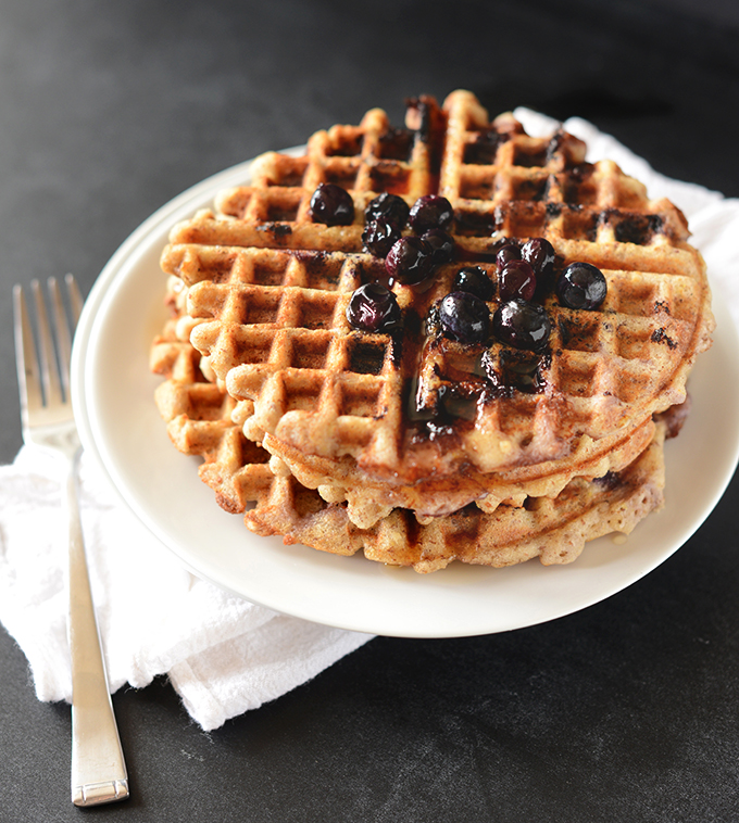 Stack of gluten-free waffles topped with blueberries
