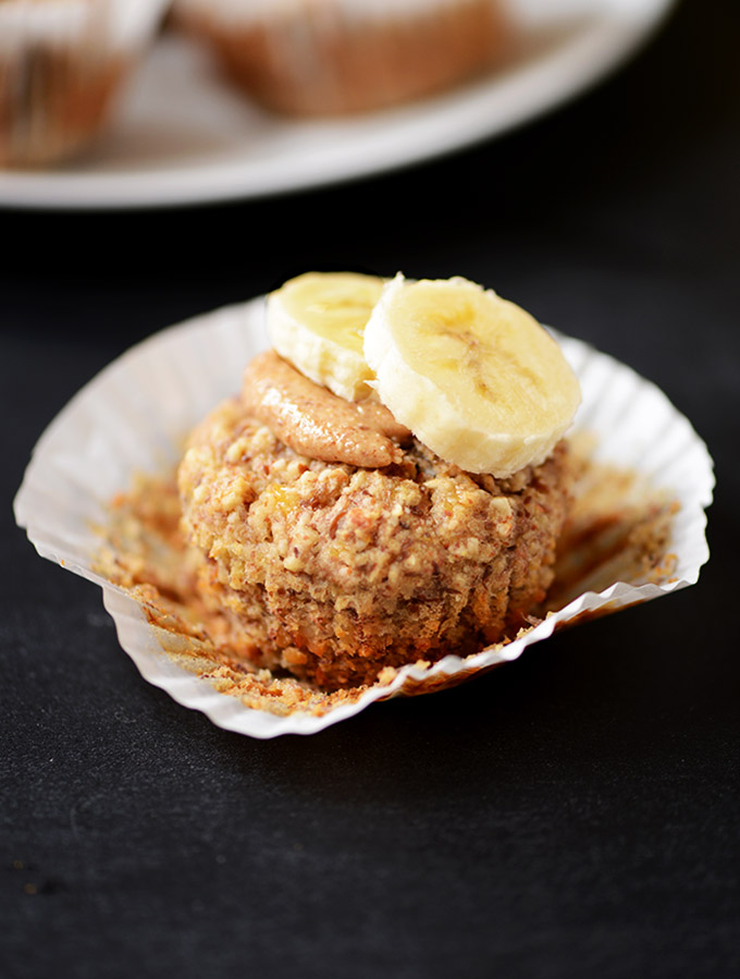 Close up shot of a Banana Muffin topped with almond butter and banana