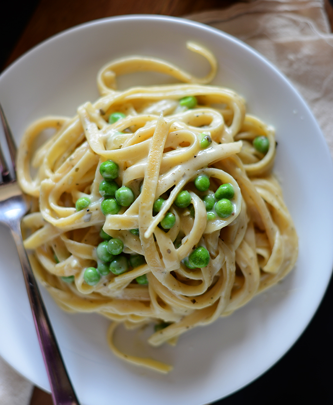 Close up shot of a plate of Healthy Alfredo Pasta with Peas