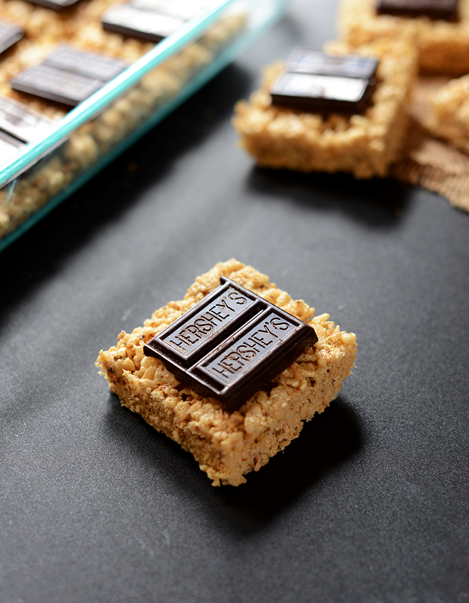 Close up shot of a Smores Rice Crispy Treat topped with Hershey's Chocolate