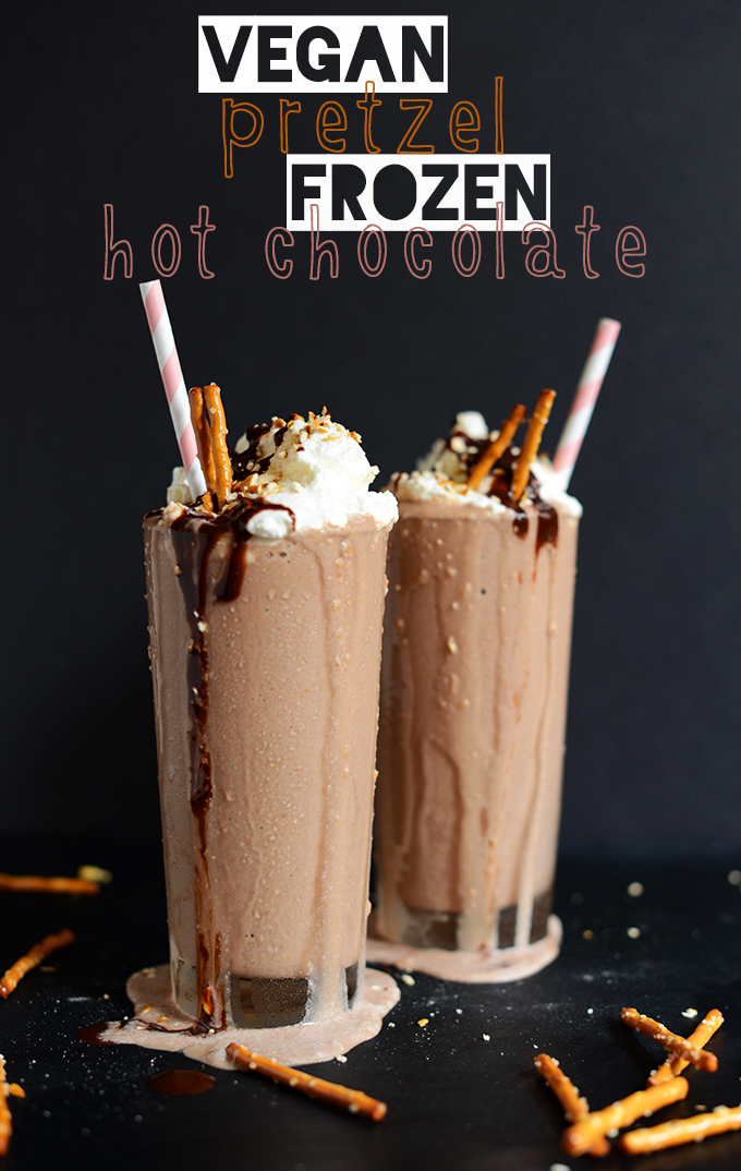 Tall glasses of Vegan Pretzel Frozen Hot Chocolate with hot fudge dripping down the side