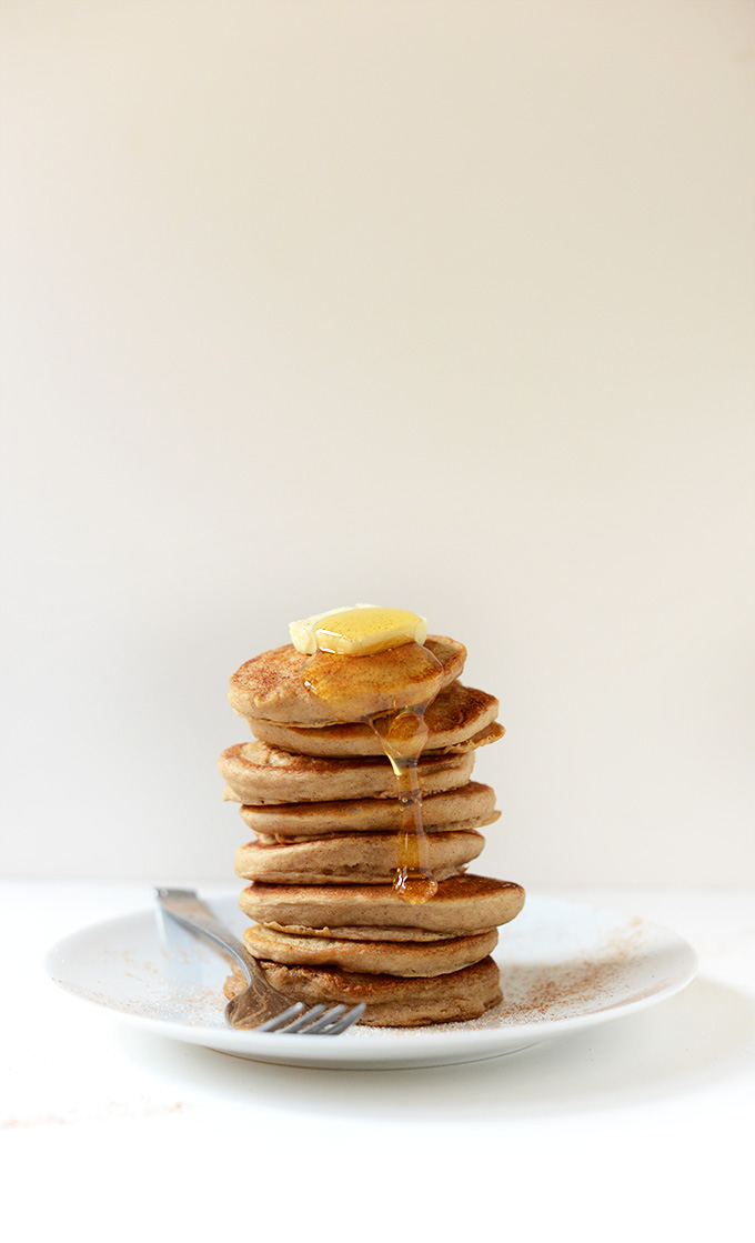 Stack of Mini Sopapilla Pancakes with butter and honey on top