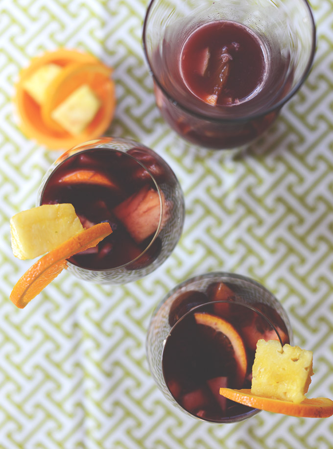 Glasses of Spanish Sangria with fresh pineapple and orange slices