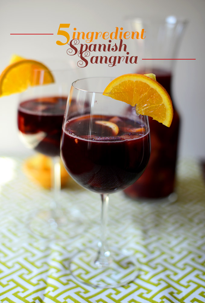Pitcher and wine glasses filled with a batch of our Spanish Sangria recipe