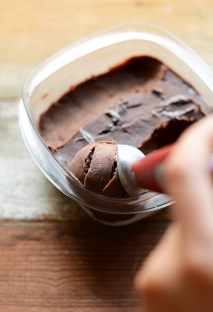 Grabbing a scoop of dairy-free chocolate ice cream for homemade Ice Cream Sandwiches