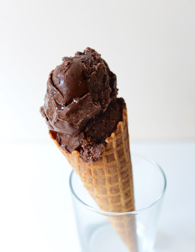 Glass holding a cone filled with Dairy-Free Chocolate Ice Cream