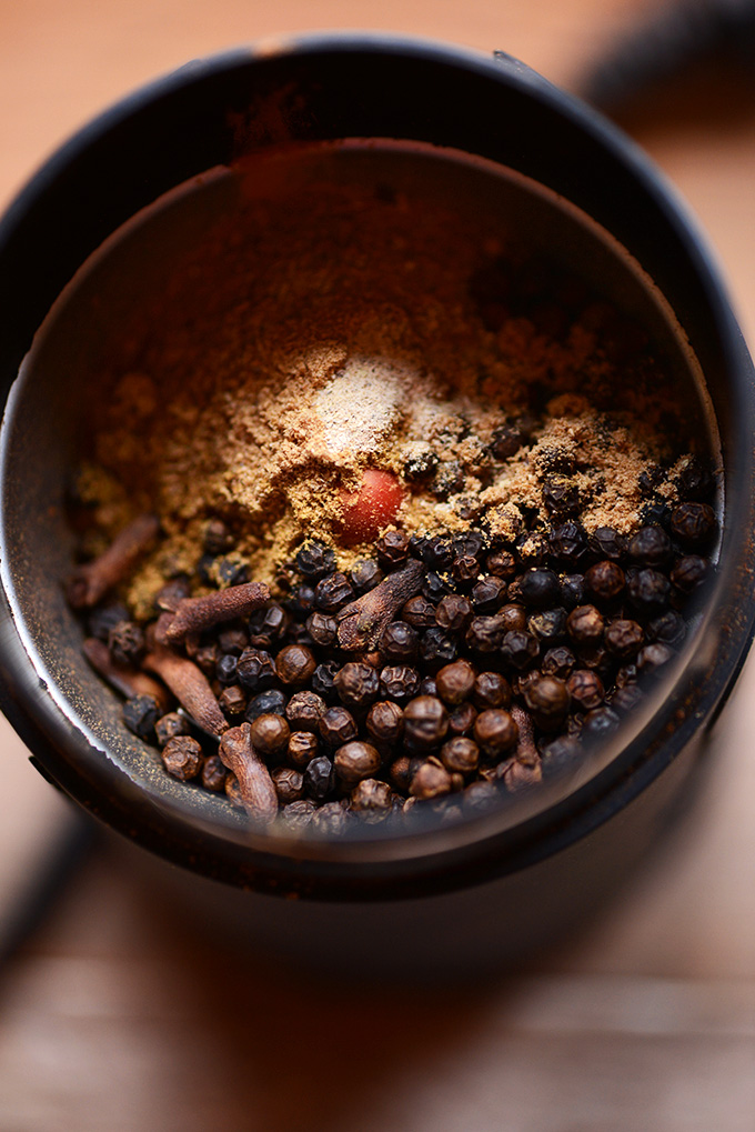 Spices in a grinder for making homemade Garam Masala