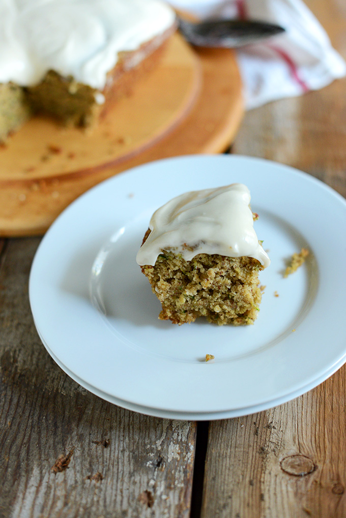 Plate with a slice of frosted Zucchini Cake for a delicious gluten-free dessert