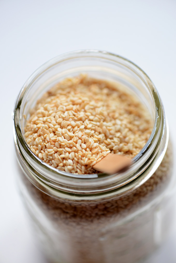 Jar of sesame seeds ready for showing you how to make tahini