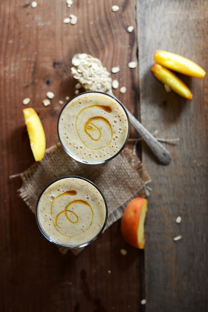Top down shot of glasses of our Peach Oat Smoothie with a caramel swirl