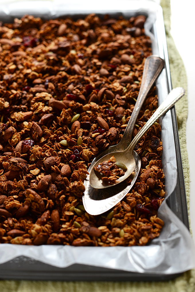 Parchment-lined baking sheet with a batch of our Sweet Potato Granola recipe
