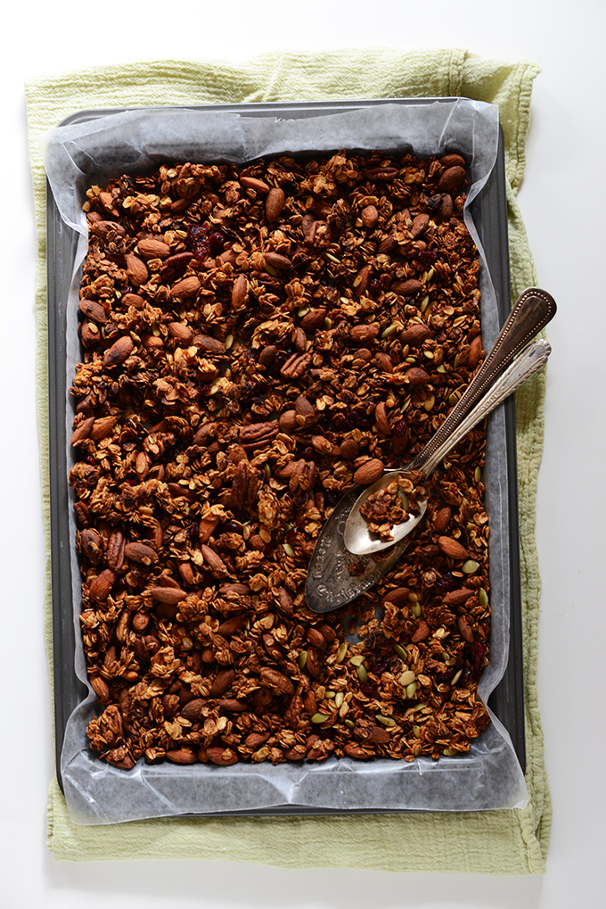Parchment-lined baking sheet filled with a batch of our Sweet Potato Granola recipe