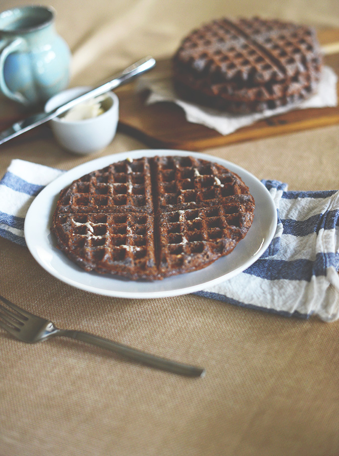 Plate and cutting board with our Vegan and Gluten-Free Blue Cornmeal Waffles