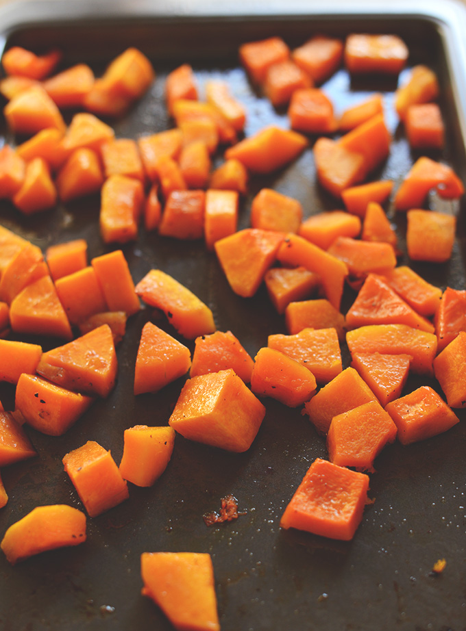Baking sheet filled with freshly roasted butternut squash