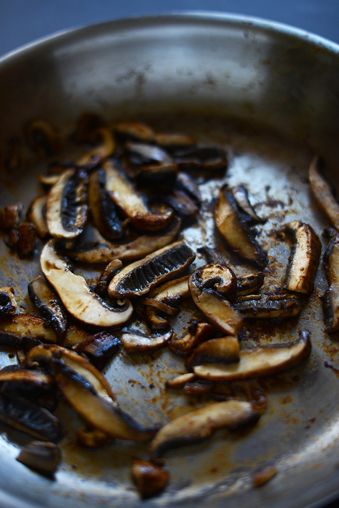 Skillet of sautéed portobello mushrooms for making vegan fajitas