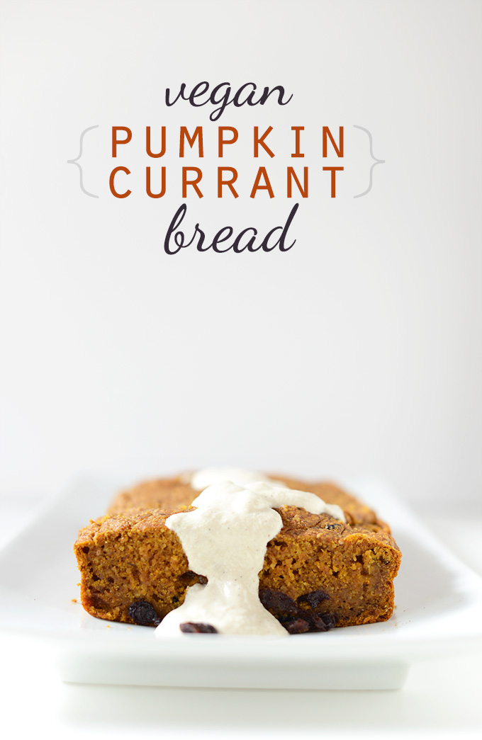 Loaf of Vegan Pumpkin Currant Bread with a drizzle of frosting