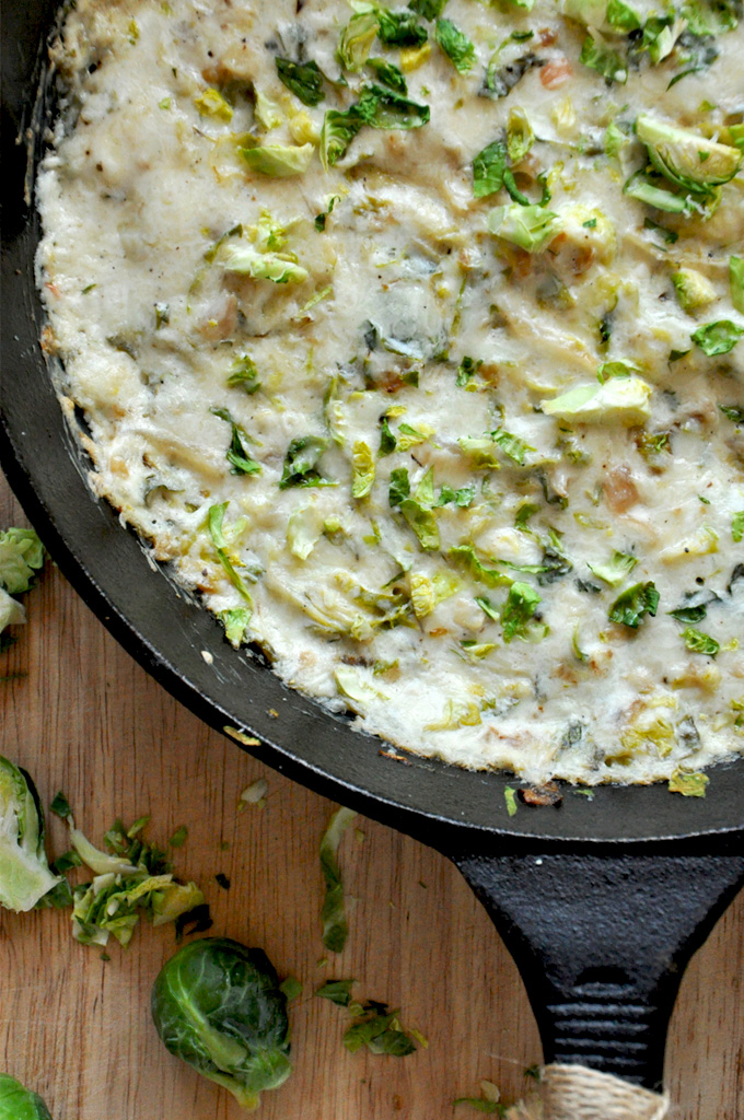 Cast-iron skillet filled with Creamy Brussels Sprout Dip for our Thanksgiving recipe roundup