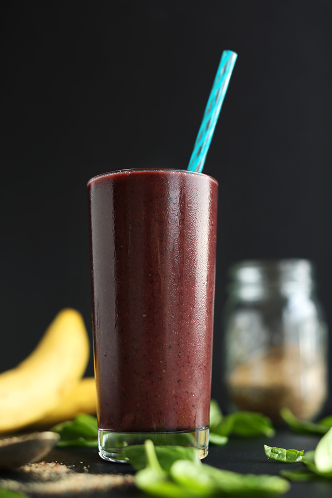 Tall glass of our simple vegan Detox Smoothie made with berries and banana
