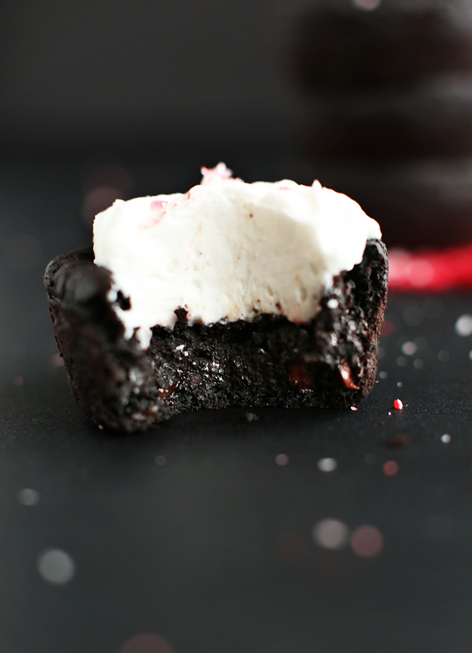 Partially eaten Fudgy Vegan Black Bean Brownie topped with coconut whipped cream