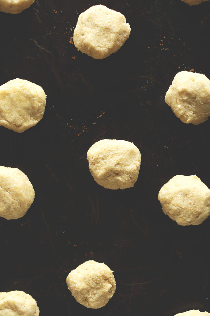 Baking sheet with balls of Gluten-Free Sugar Cookie Dough