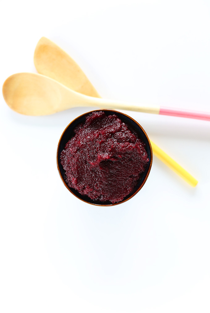 Wooden spoons and a bowl filled with homemade beet puree
