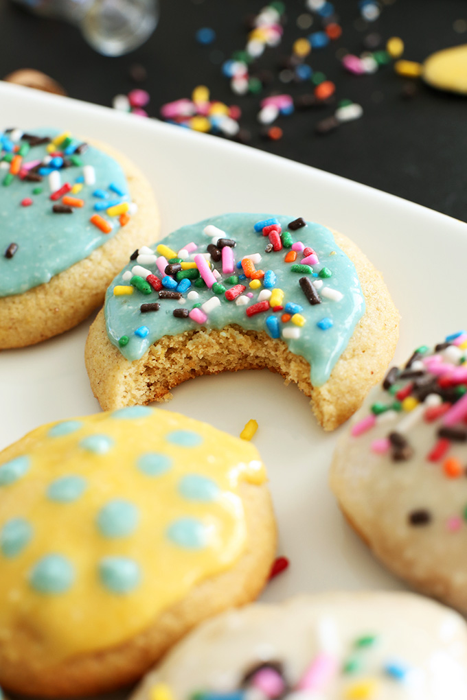 Gluten-Free Sugar Cookies topped with homemade frosting and sprinkles
