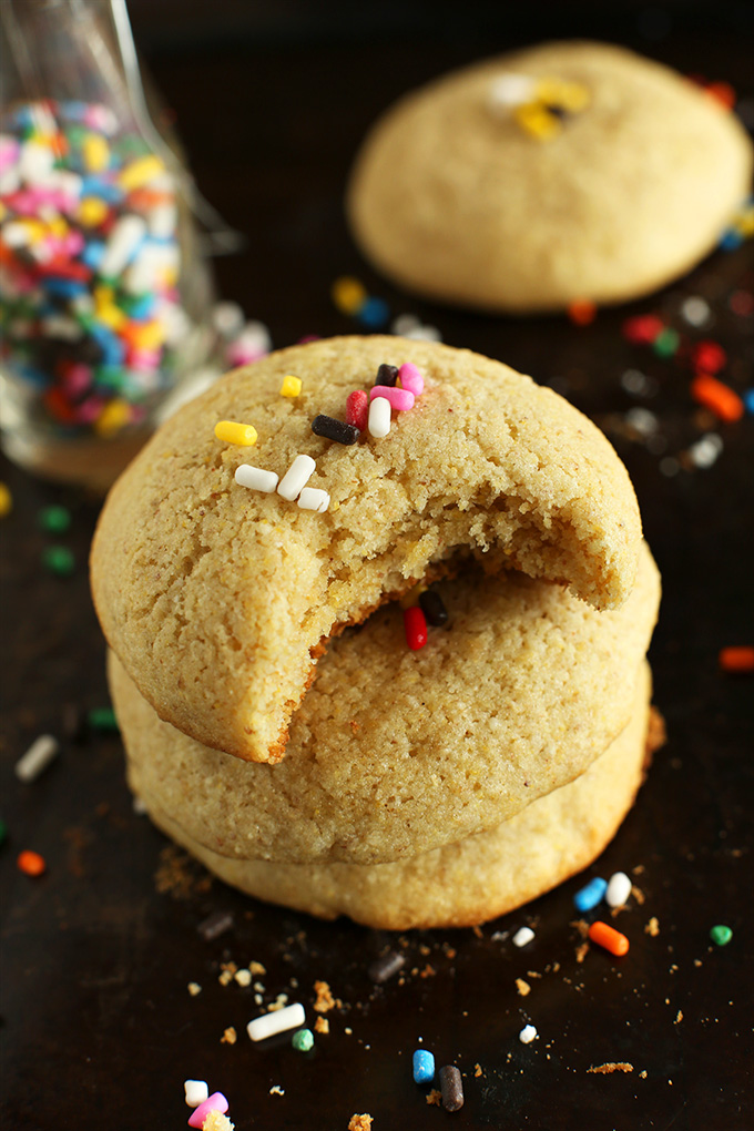 Gluten-Free Sugar Cookies stacked up and topped with sprinkles