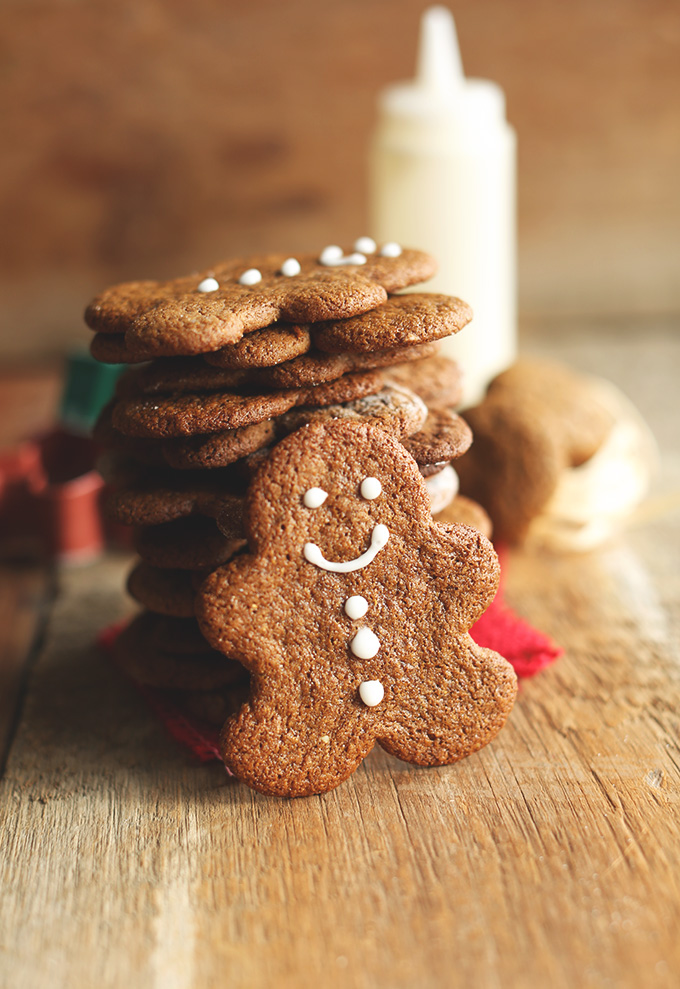 Gingerbread Man leaning on a stack of his fellow gluten-free vegan cookies