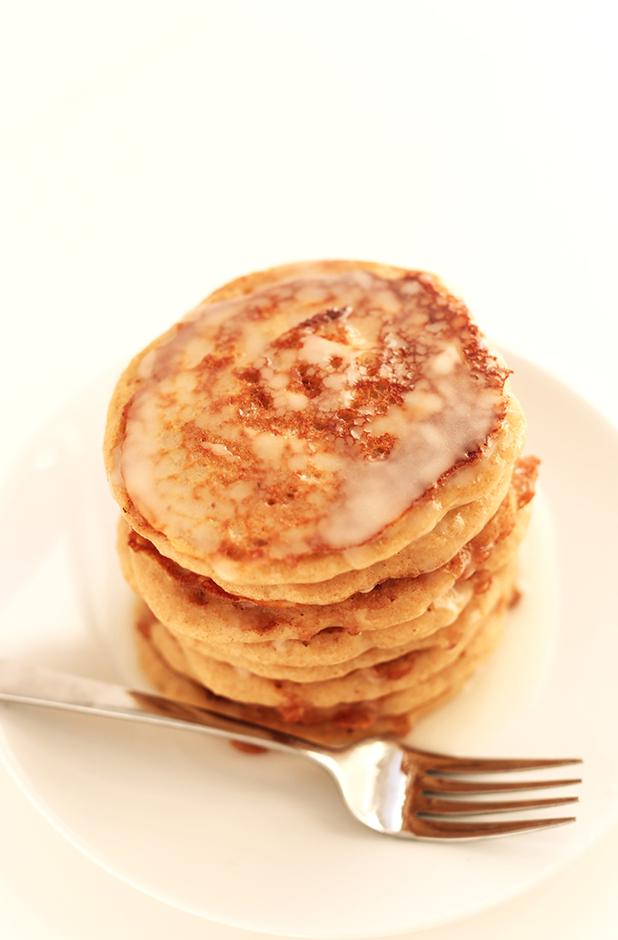 Stack of Vegan Cinnamon Roll Pancakes with icing