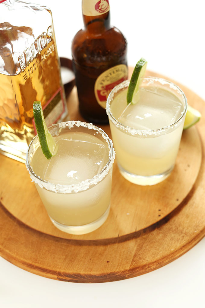 Glasses of Ginger Beer Margaritas with lime and salt rims