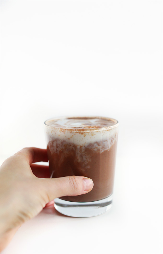 Grabbing a glass of Vegan Hot Cocoa for a warming winter beverage