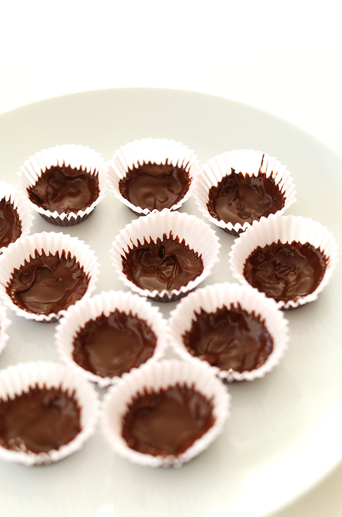 Plate of delicious homemade Chocolate Almond Butter Cups in mini muffin tin liners