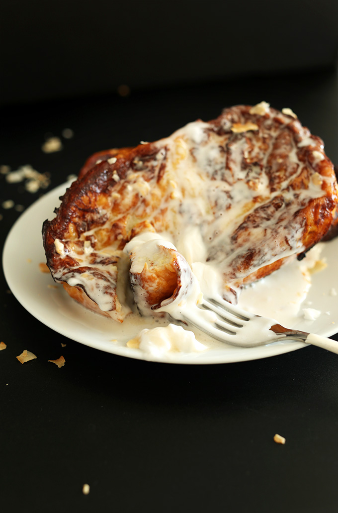 Using a fork to grab a bite of a slice of dairy-free Coconut Cream Pie French Toast