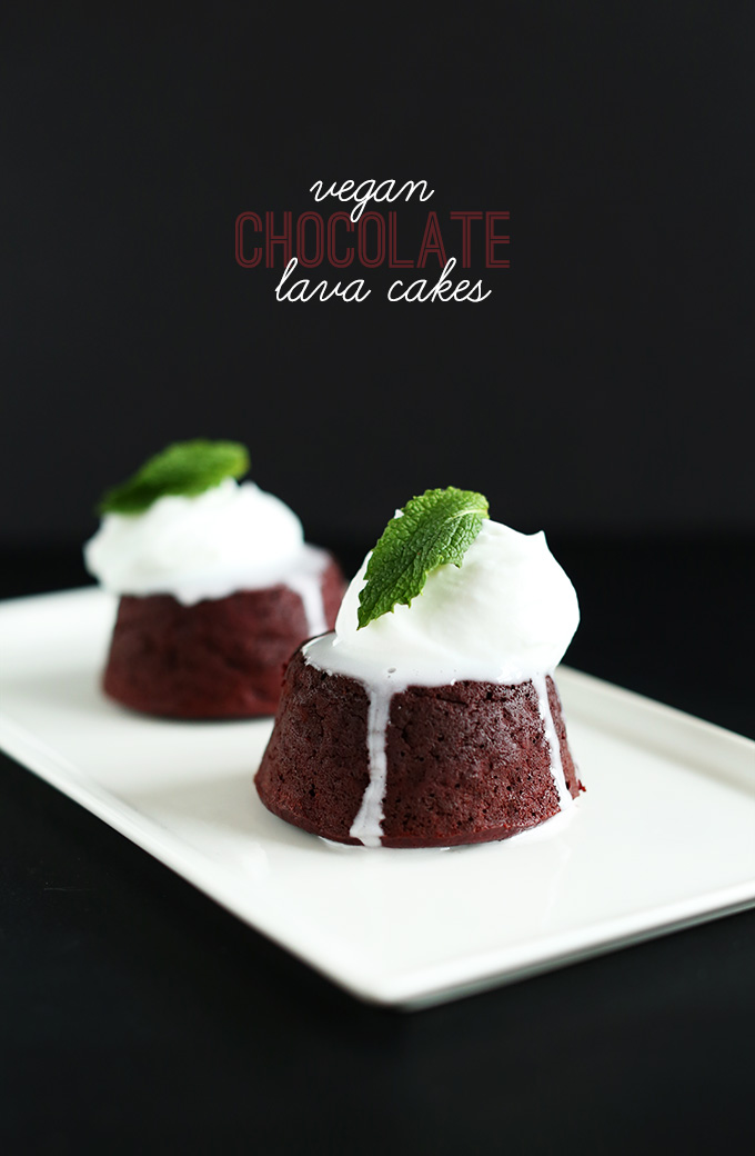 Plate of Vegan Chocolate Lava cakes topped with coconut whipped cream and fresh mint