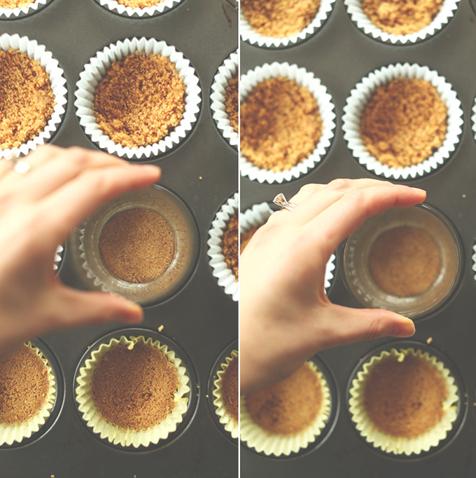 Using a glass to press down graham cracker crust in muffin tins