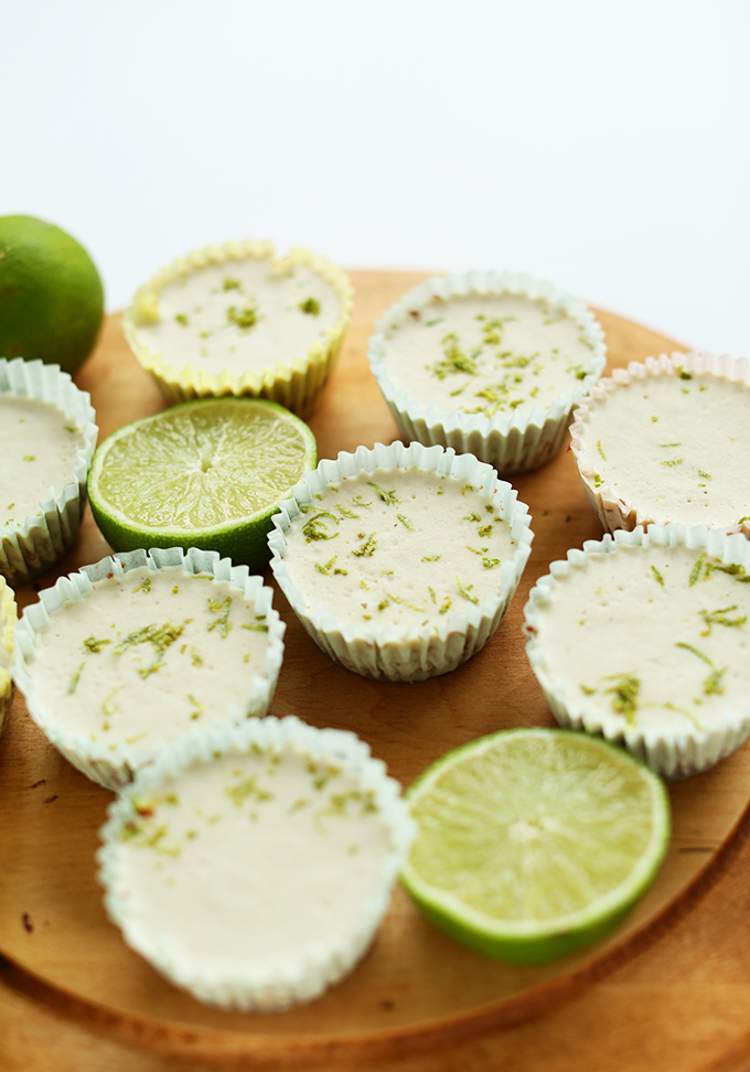 Chilled Mini Vegan Key Lime Pies resting on a baking sheet