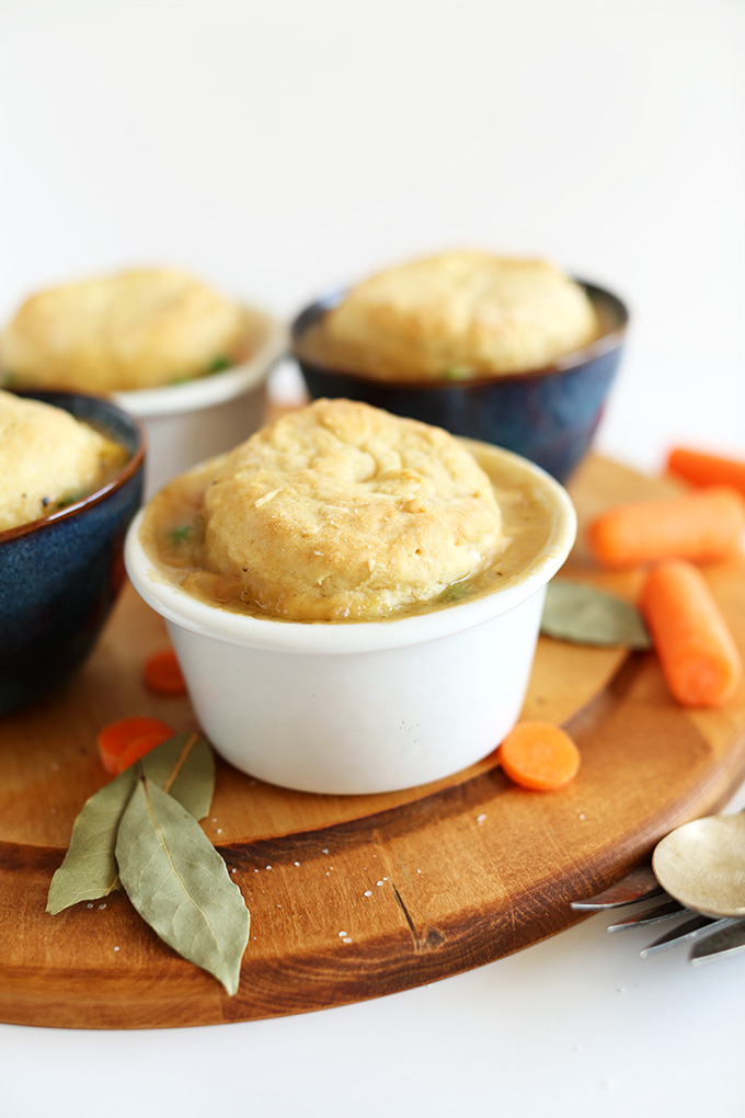 Close up shot of vegetable-packed Vegan Pot Pies with flaky biscuits