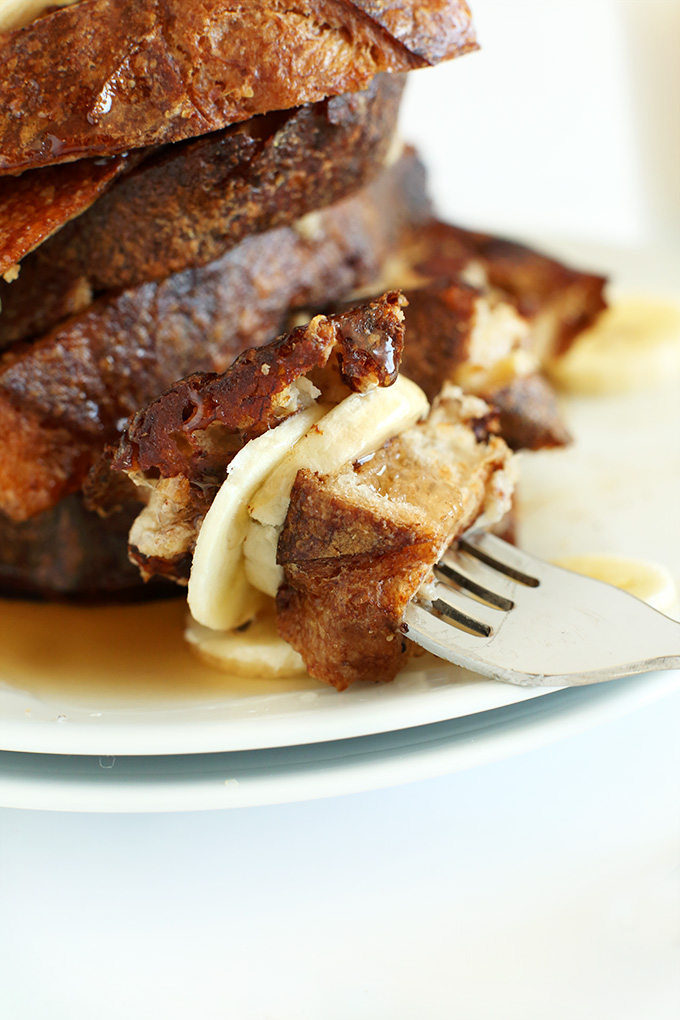Fork with a big bite of Vegan Banana French Toast