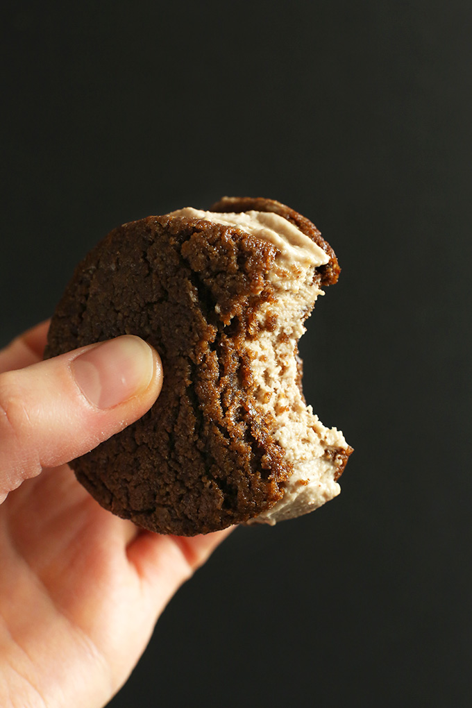 Holding up a partially eaten Chai Ice Cream Sandwich made with Ginger Cookies