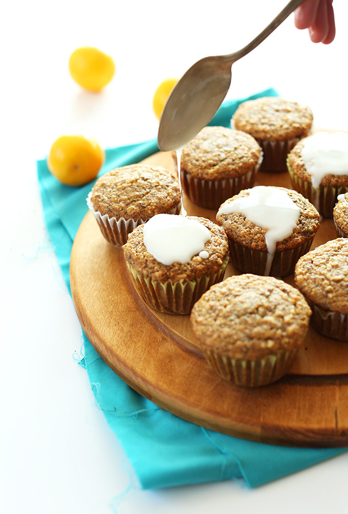 Drizzling icing onto a batch of our Easy 1-Bowl Meyer Lemon Poppyseed Muffins