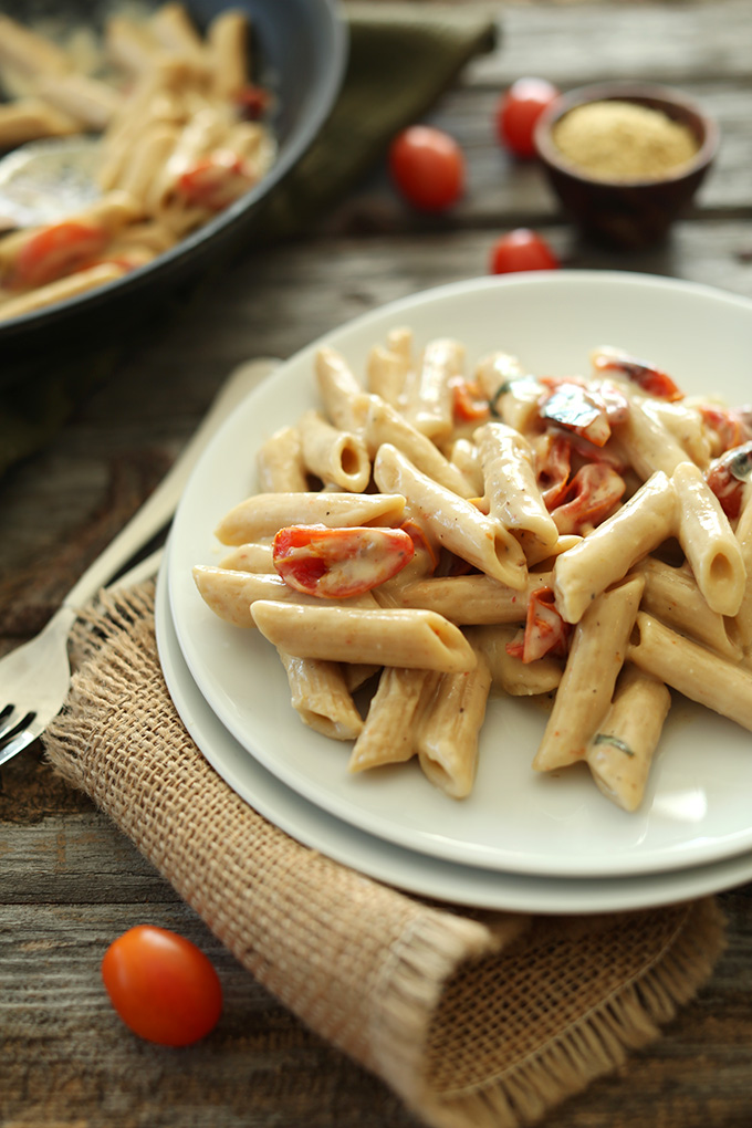 Plate of Creamy Vegan Garlic Pasta with Roasted Tomatoes