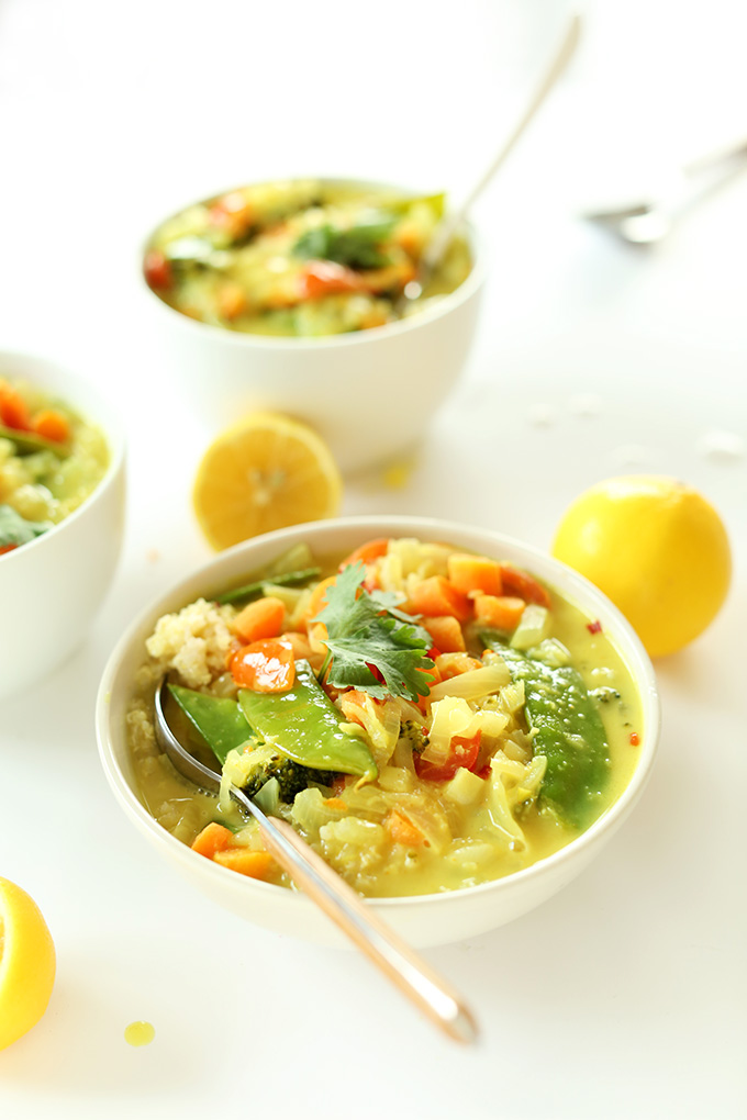 Lemon halves and bowls of Easy Coconut Curry with Coconut Quinoa