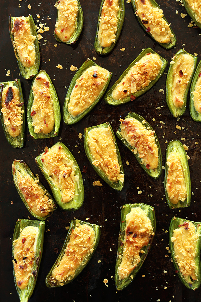 Jalapeno Poppers on a baking sheet for a delicious gluten-free vegan appetizer