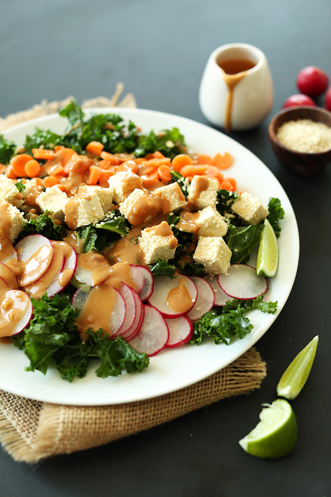 Plate of our Thai Kale Salad recipe with Sesame Tofu and Peanut Dressing